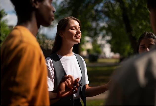 Clients in a guided outdoor mindfulness circle at The Grove — deeper therapeutic work on Northbound's Garden Grove campus.