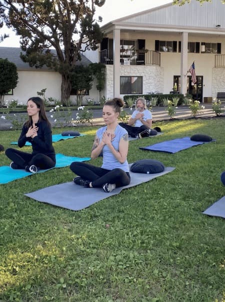 Outdoor meditation circle on the lawn at Northbound's Garden Grove campus.